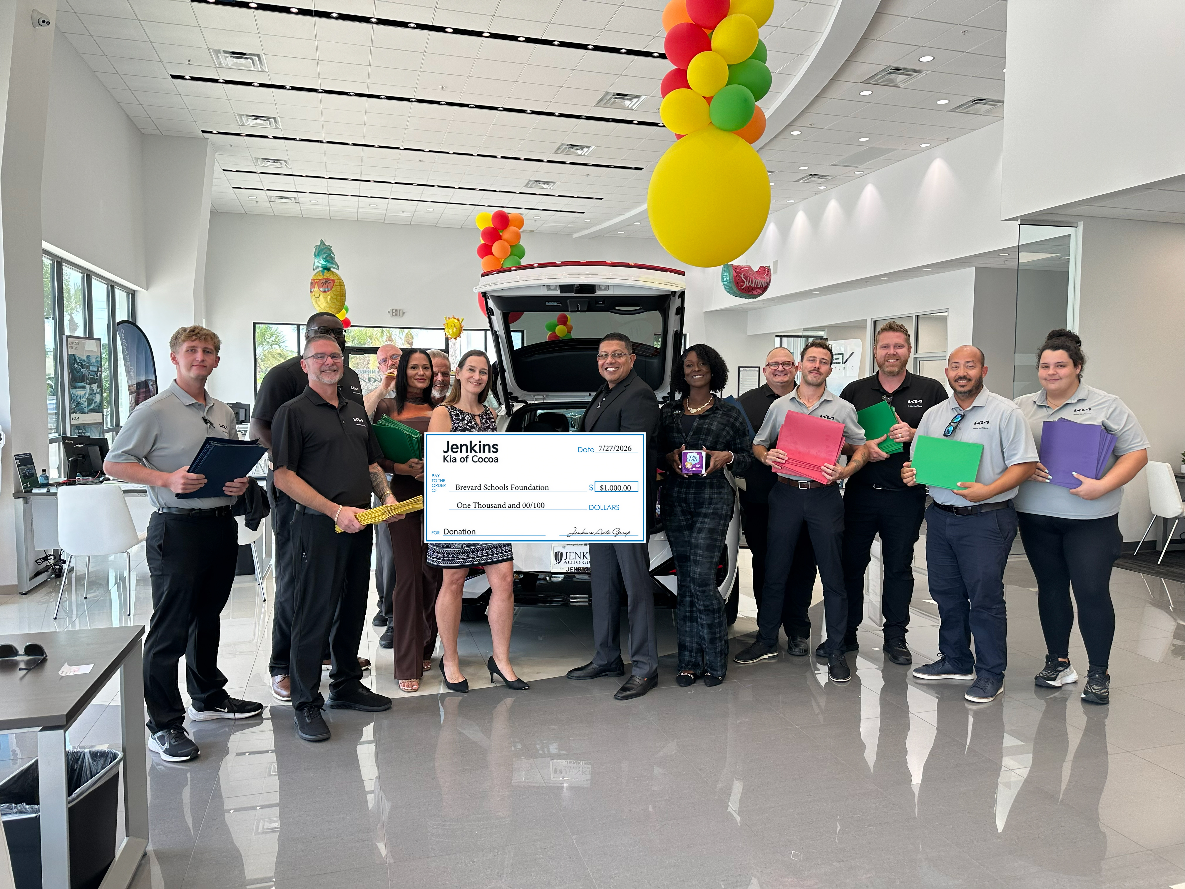Jenkins Kia of Cocoa presenting a $1,000 donation check to the Brevard Schools Foundation